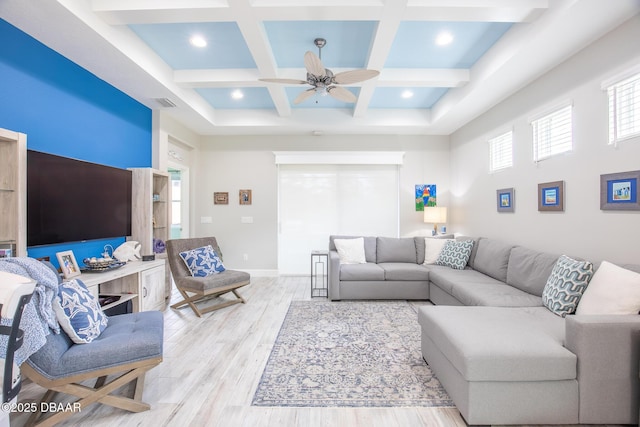 living room featuring coffered ceiling, beam ceiling, light hardwood / wood-style floors, and ceiling fan