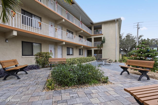 surrounding community featuring a patio area