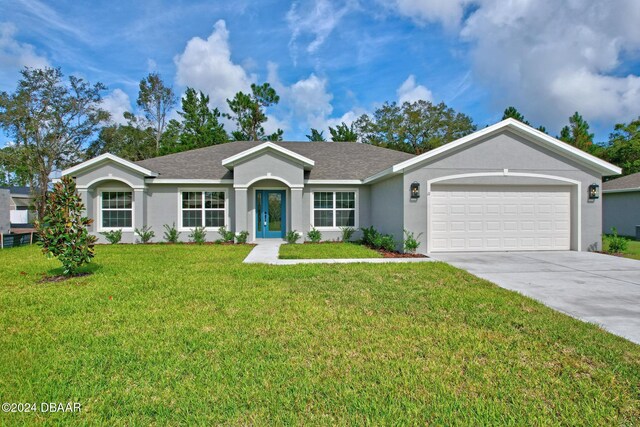 ranch-style home with a garage and a front yard