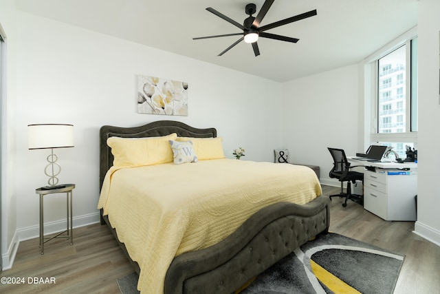 bedroom featuring ceiling fan and dark hardwood / wood-style flooring