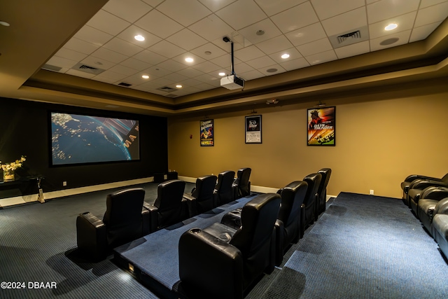 cinema with a drop ceiling and a tray ceiling