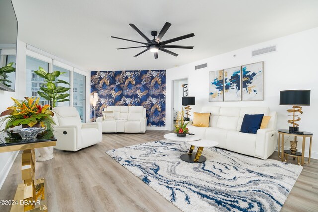 241 Riverside Dr Unit 2007, Holly Hill, FL 32117 - living room with ceiling fan, wood finished floors, and baseboards