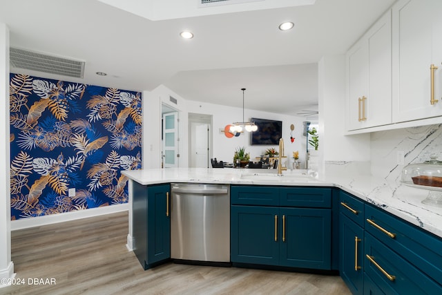 kitchen with hanging light fixtures, sink, dishwasher, kitchen peninsula, and light hardwood / wood-style flooring