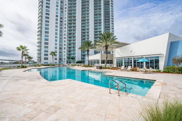 view of pool featuring a patio