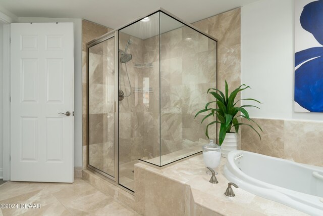 241 Riverside Dr Unit 2007, Holly Hill, FL 32117 - full bath featuring a garden tub and a shower stall
