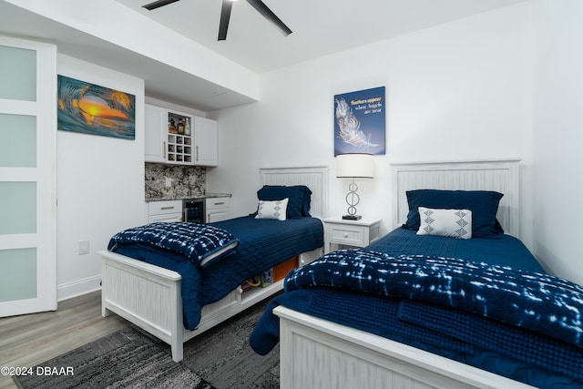 bedroom featuring dark wood-type flooring and ceiling fan