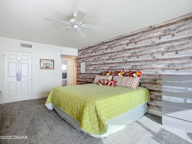 3145 S Atlantic Ave Unit 405, Daytona Beach, FL 32118 - carpeted bedroom featuring wood walls, baseboards, and a ceiling fan