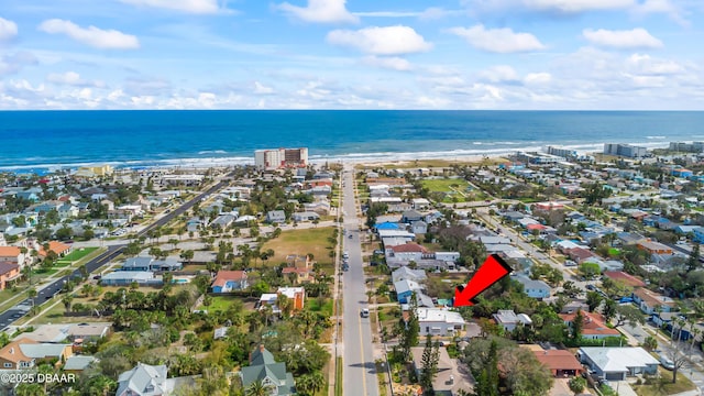 aerial view featuring a view of the beach and a water view