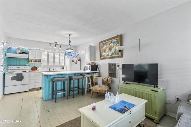 living area with light wood finished floors