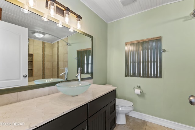 full bath with tile patterned flooring, toilet, vanity, baseboards, and ornamental molding