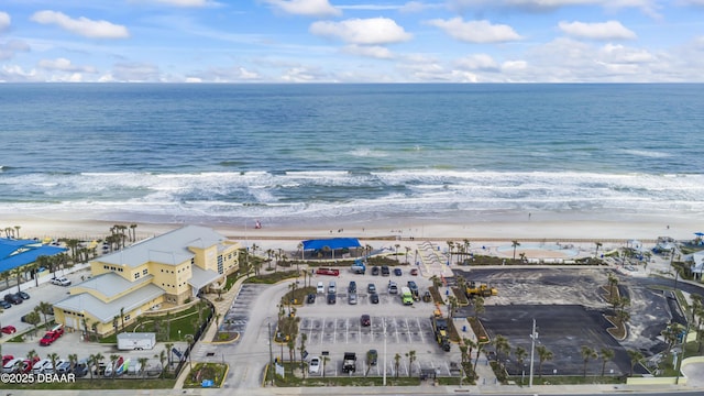 aerial view with a water view and a view of the beach