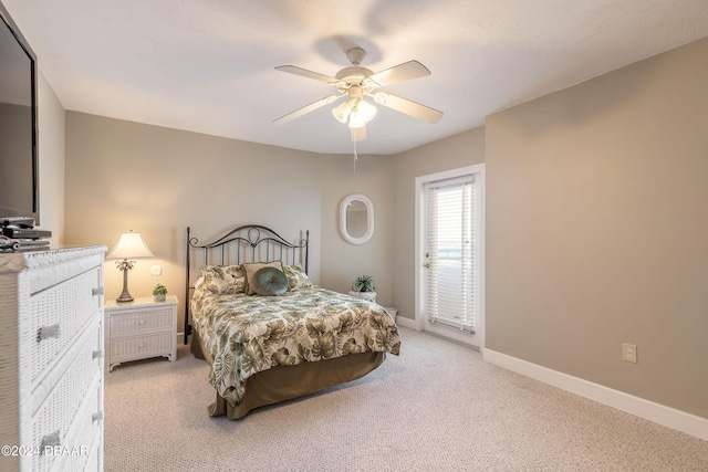 bedroom featuring ceiling fan and light colored carpet