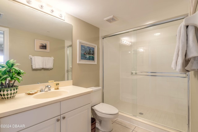 bathroom with toilet, tile patterned flooring, and walk in shower