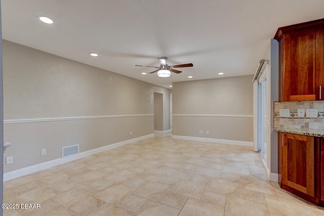 spare room featuring ceiling fan