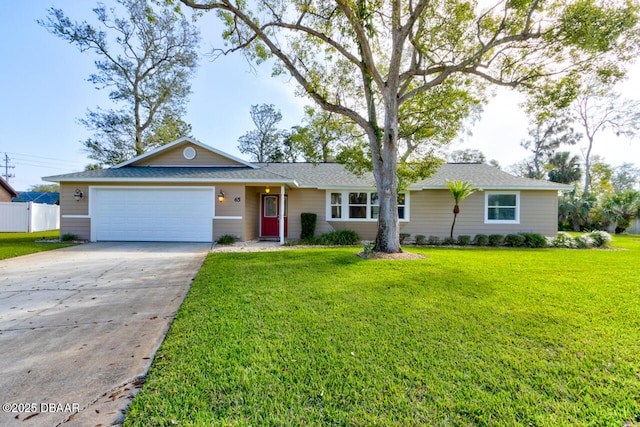 ranch-style home with a garage and a front yard