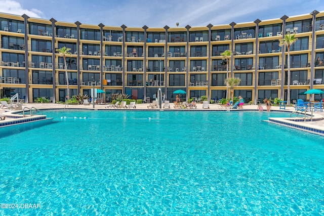 community pool featuring a patio area
