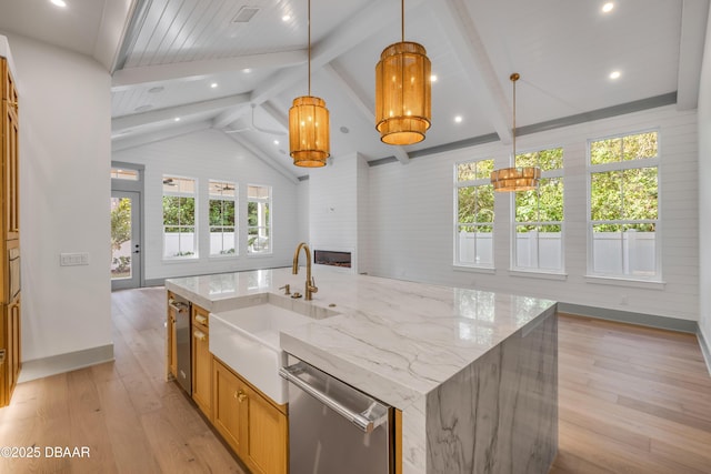 kitchen with lofted ceiling with beams, a sink, open floor plan, light wood-type flooring, and dishwasher