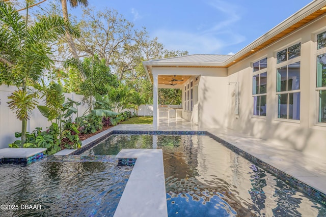 view of pool featuring a diving board, ceiling fan, a patio, and a fenced backyard