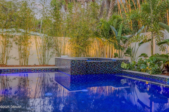 view of swimming pool featuring a fenced in pool and a fenced backyard