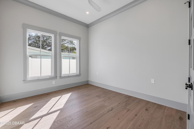 spare room with light wood finished floors, ceiling fan, baseboards, and recessed lighting