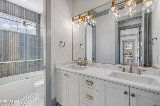 full bathroom featuring enclosed tub / shower combo, a sink, and a healthy amount of sunlight