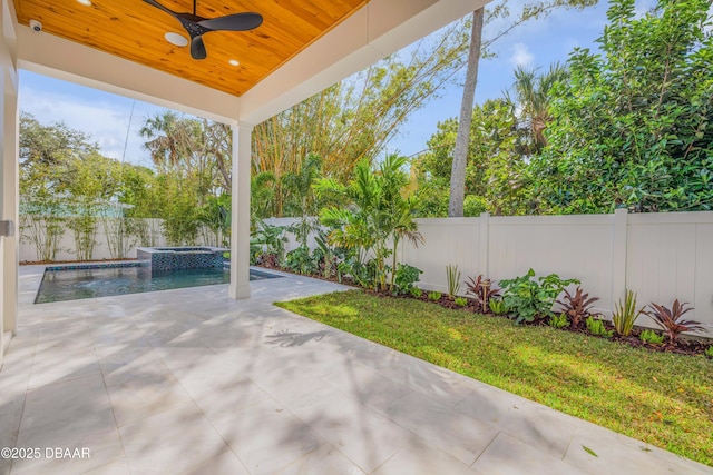 view of patio featuring a fenced in pool, a fenced backyard, and ceiling fan