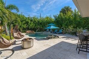 view of pool with a patio