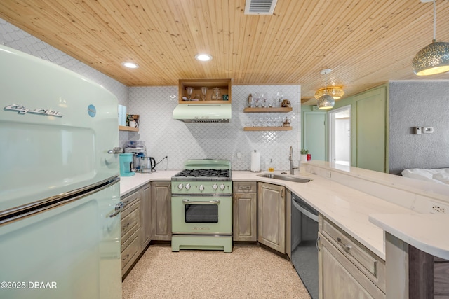 kitchen featuring hanging light fixtures, stove, a sink, dishwasher, and fridge