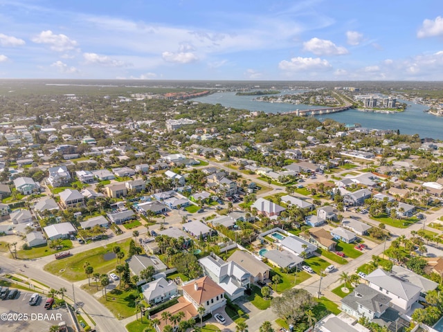 drone / aerial view with a residential view and a water view