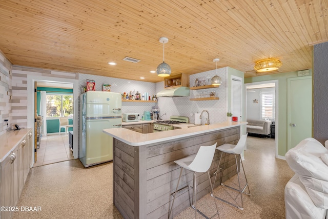 kitchen with white appliances, wood ceiling, a peninsula, hanging light fixtures, and open shelves