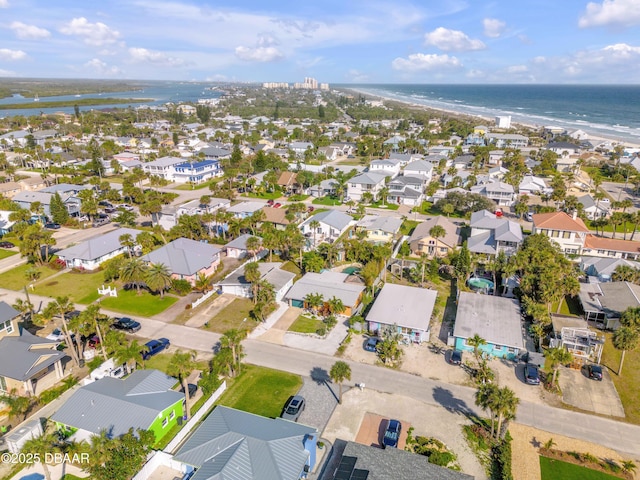 bird's eye view featuring a water view and a residential view