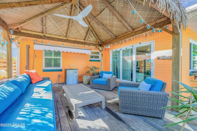 wooden terrace featuring outdoor lounge area