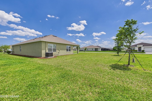2625 Neverland Dr, New Smyrna Beach, FL 32168 - view of yard featuring central AC