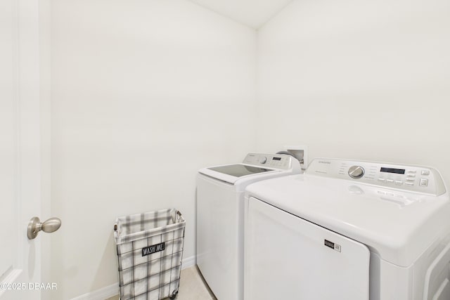 2625 Neverland Dr, New Smyrna Beach, FL 32168 - washroom with washing machine and dryer, laundry area, and baseboards