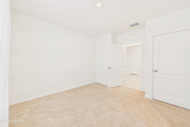 2625 Neverland Dr, New Smyrna Beach, FL 32168 - unfurnished room featuring visible vents, baseboards, and carpet flooring
