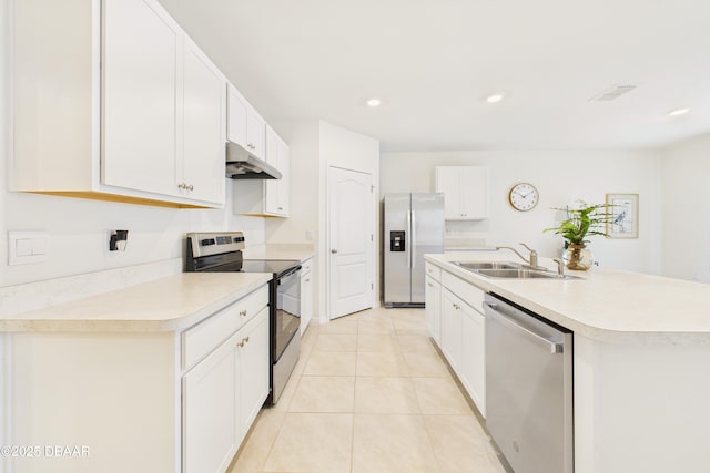 2625 Neverland Dr, New Smyrna Beach, FL 32168 - kitchen with light tile patterned floors, a sink, light countertops, under cabinet range hood, and stainless steel appliances