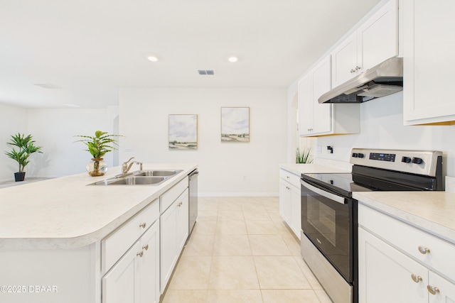 2625 Neverland Dr, New Smyrna Beach, FL 32168 - kitchen with light countertops, under cabinet range hood, a sink, and stainless steel appliances