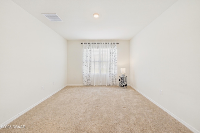 2625 Neverland Dr, New Smyrna Beach, FL 32168 - empty room with visible vents, baseboards, and light carpet