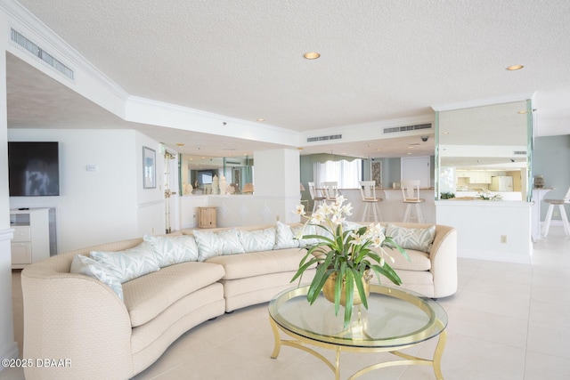 2425 S Atlantic Ave Unit 801, Daytona Beach Shores, FL 32118 - living area with a textured ceiling, crown molding, tile patterned flooring, and recessed lighting