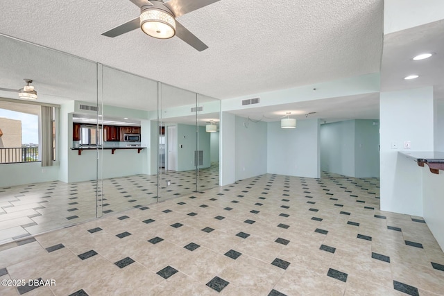 2425 S Atlantic Ave Unit 801, Daytona Beach Shores, FL 32118 - unfurnished room with ceiling fan, a textured ceiling, recessed lighting, and light tile patterned floors