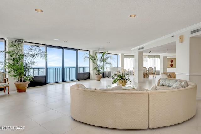 2425 S Atlantic Ave Unit 801, Daytona Beach Shores, FL 32118 - living room with a wall of windows, light tile patterned floors, and ornamental molding