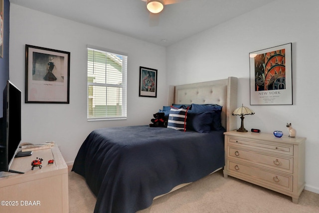 bedroom with light carpet and ceiling fan