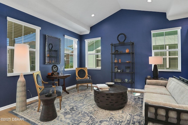 living area featuring lofted ceiling, recessed lighting, baseboards, and wood finished floors