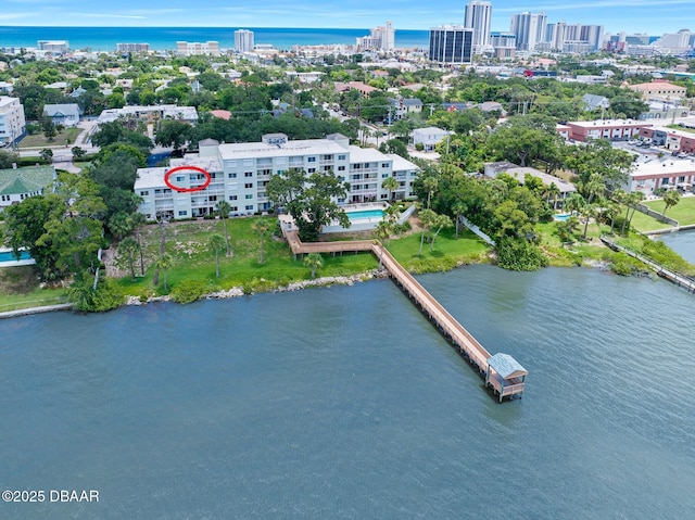 birds eye view of property with a water view