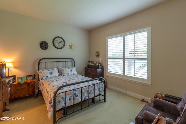 bedroom with light colored carpet