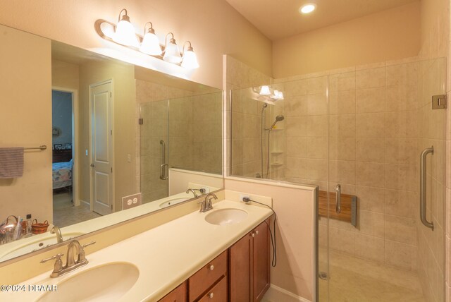 bathroom with vanity and an enclosed shower