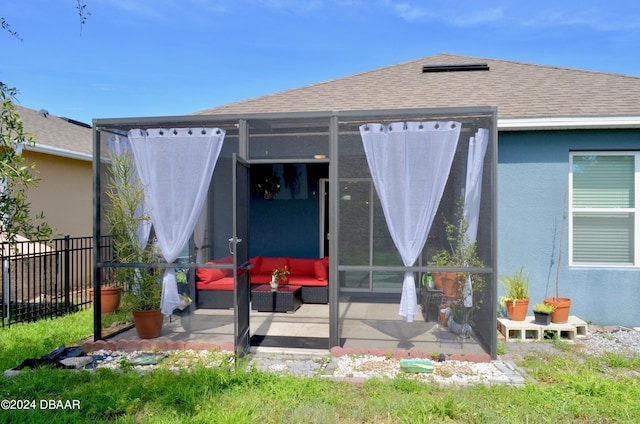 226 Meghan Cir, Deland, FL 32724 - back of house with fence, a shingled roof, stucco siding, a patio area, and a sunroom