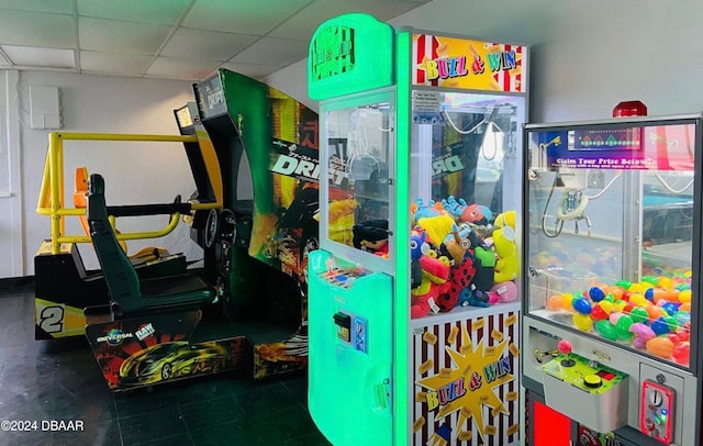 recreation room with a drop ceiling