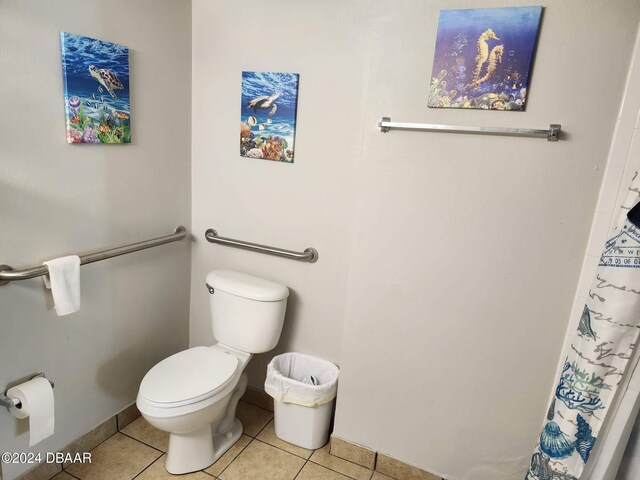 bathroom featuring tile patterned flooring and toilet