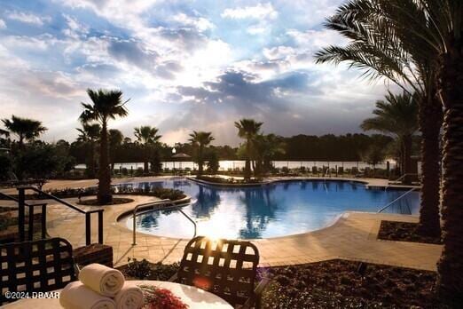 view of swimming pool featuring a patio area